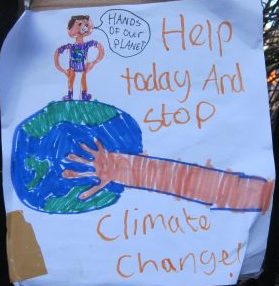 Demonstration poster -- climate change march, London 2015 -- photo by Ana Gobledale